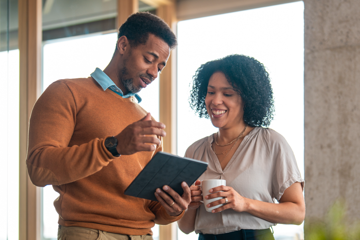 couple looking at notebook image