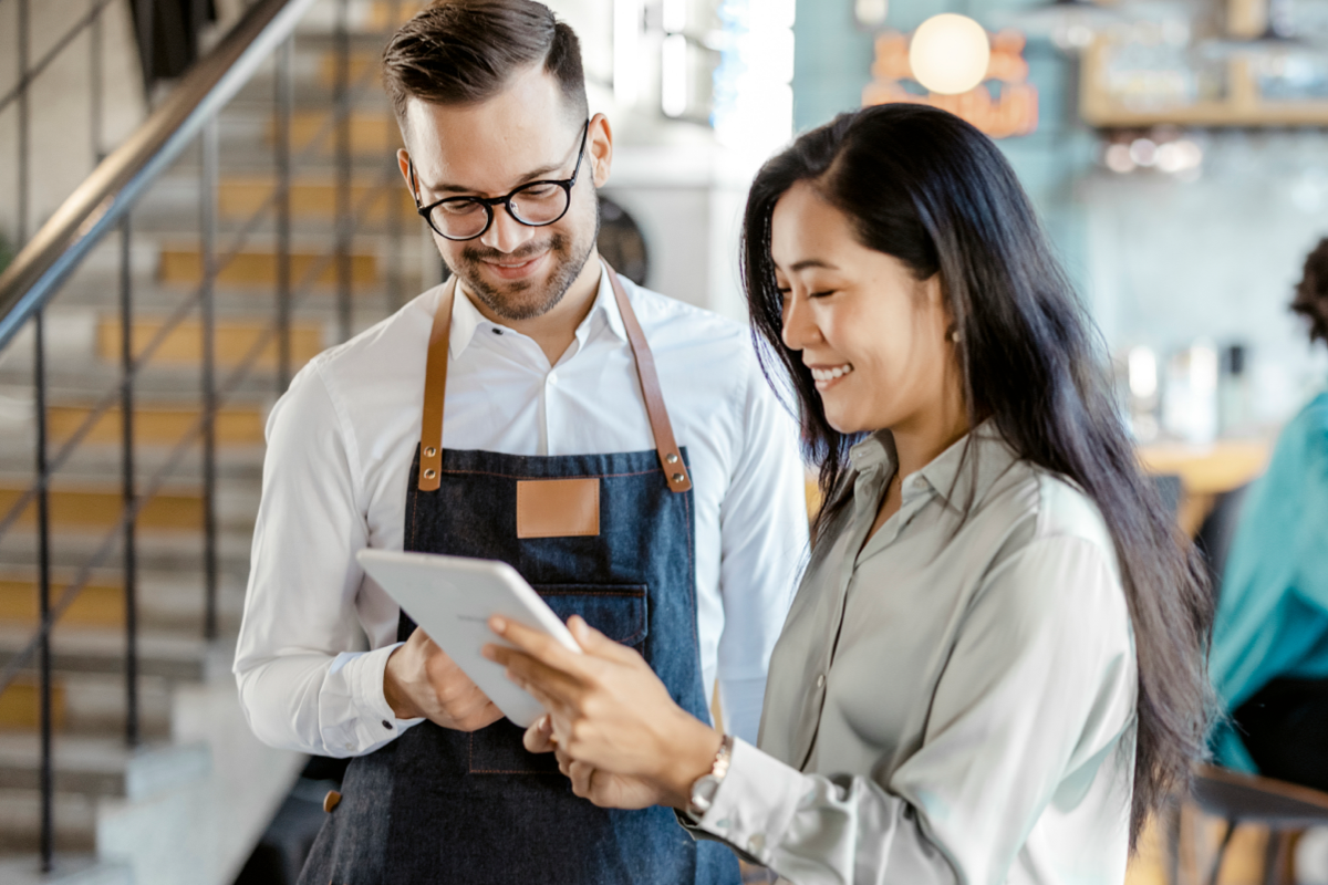 couple holding notebook image