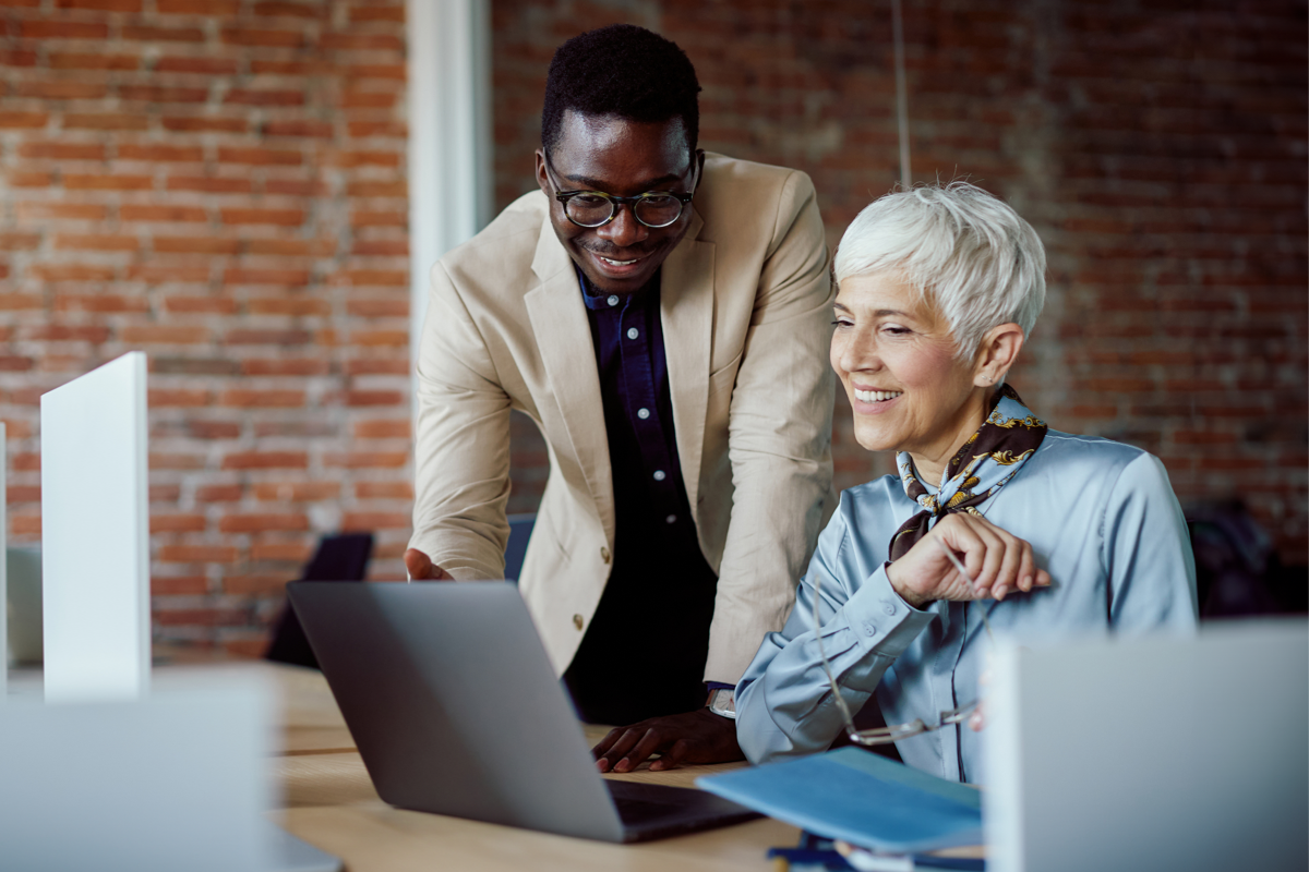 man and lady working on laptop image